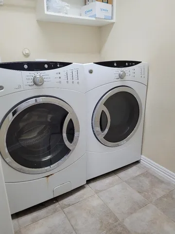 a utility room with dryer and washer