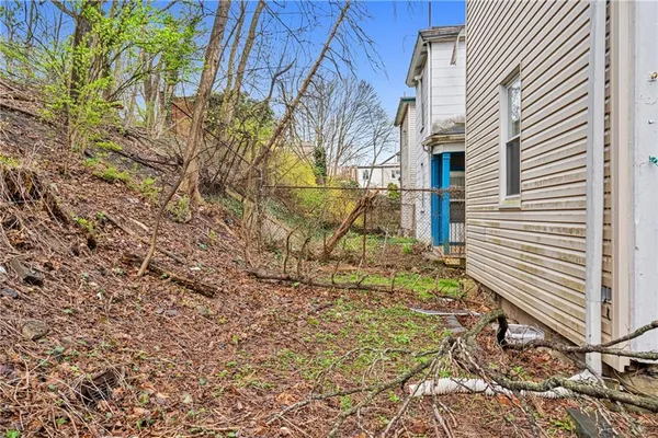 a view of a backyard of the house