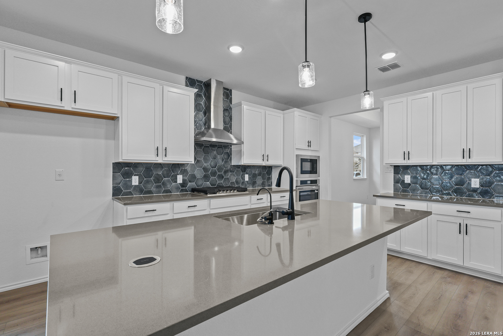 7432 Cremorne Converse, TX 78109 - Photo 12 of 35 a kitchen with stainless steel appliances granite countertop a sink a stove and cabinets