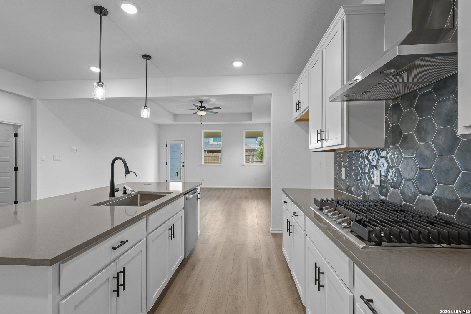 7432 Cremorne Converse, TX 78109 - Photo 15 of 35 a kitchen with stainless steel appliances granite countertop a sink stove and cabinets