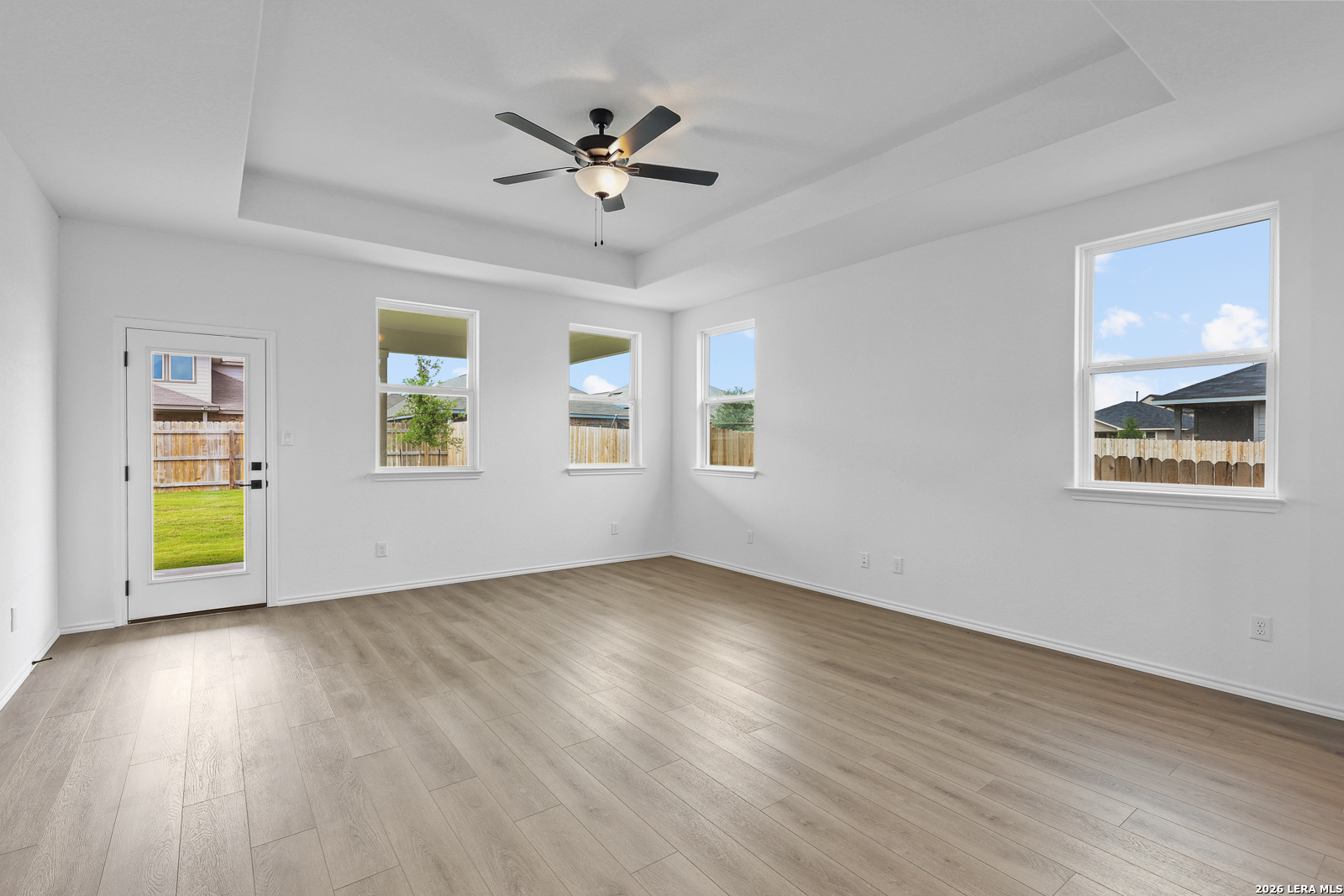 7432 Cremorne Converse, TX 78109 - Photo 18 of 35 a view of an empty room with a window and wooden floor