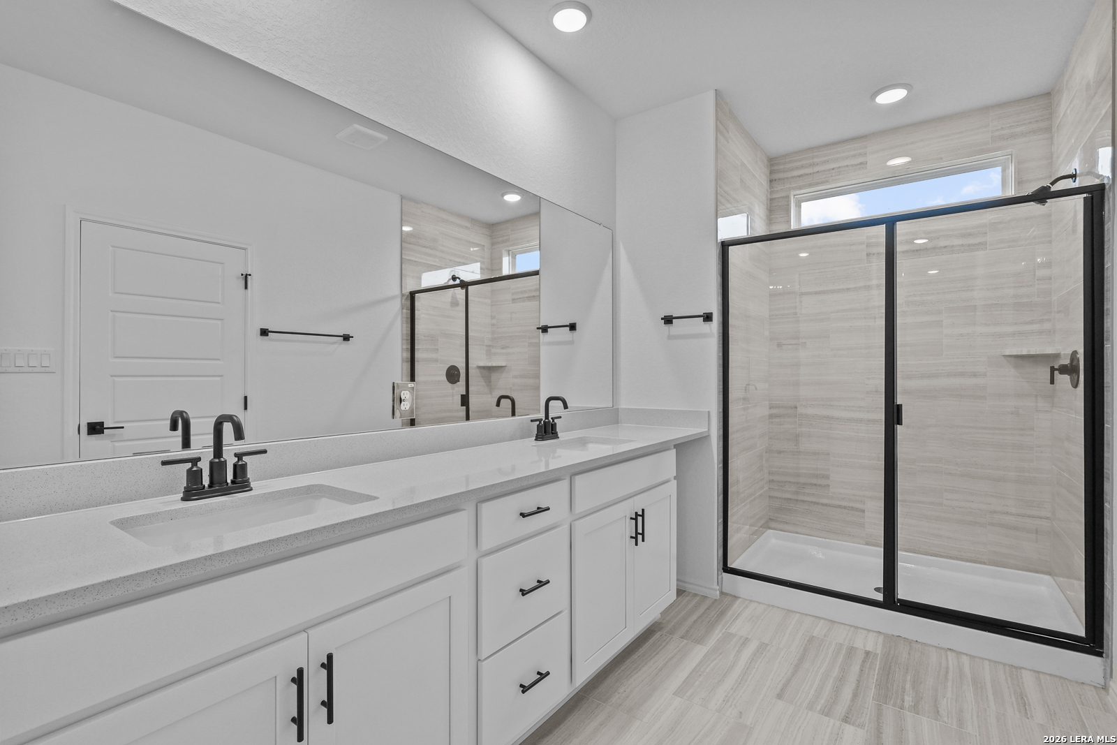 7432 Cremorne Converse, TX 78109 - Photo 21 of 35 a bathroom with a double vanity sink mirror and shower