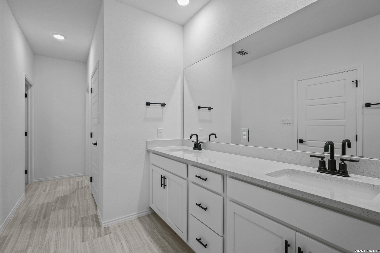 7432 Cremorne Converse, TX 78109 - Photo 24 of 35 a spacious bathroom with a double vanity sink and mirror
