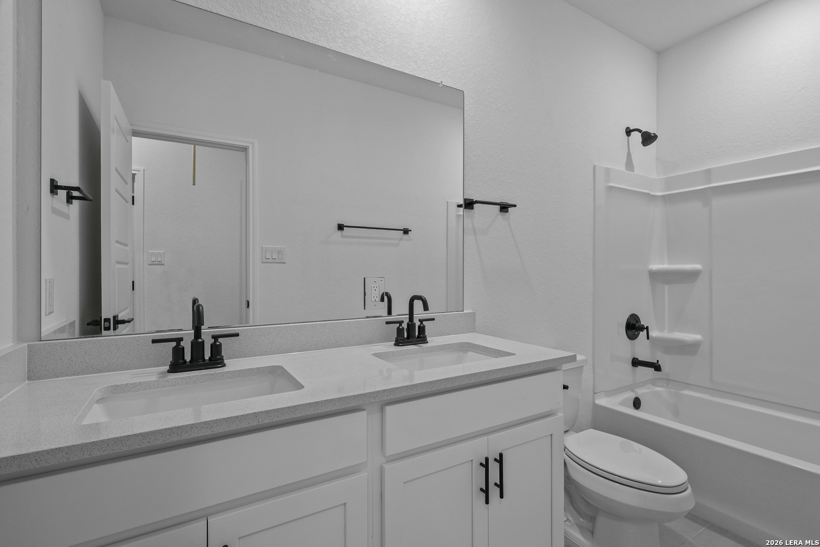 7432 Cremorne Converse, TX 78109 - Photo 28 of 35 a bathroom with a sink a toilet and a mirror