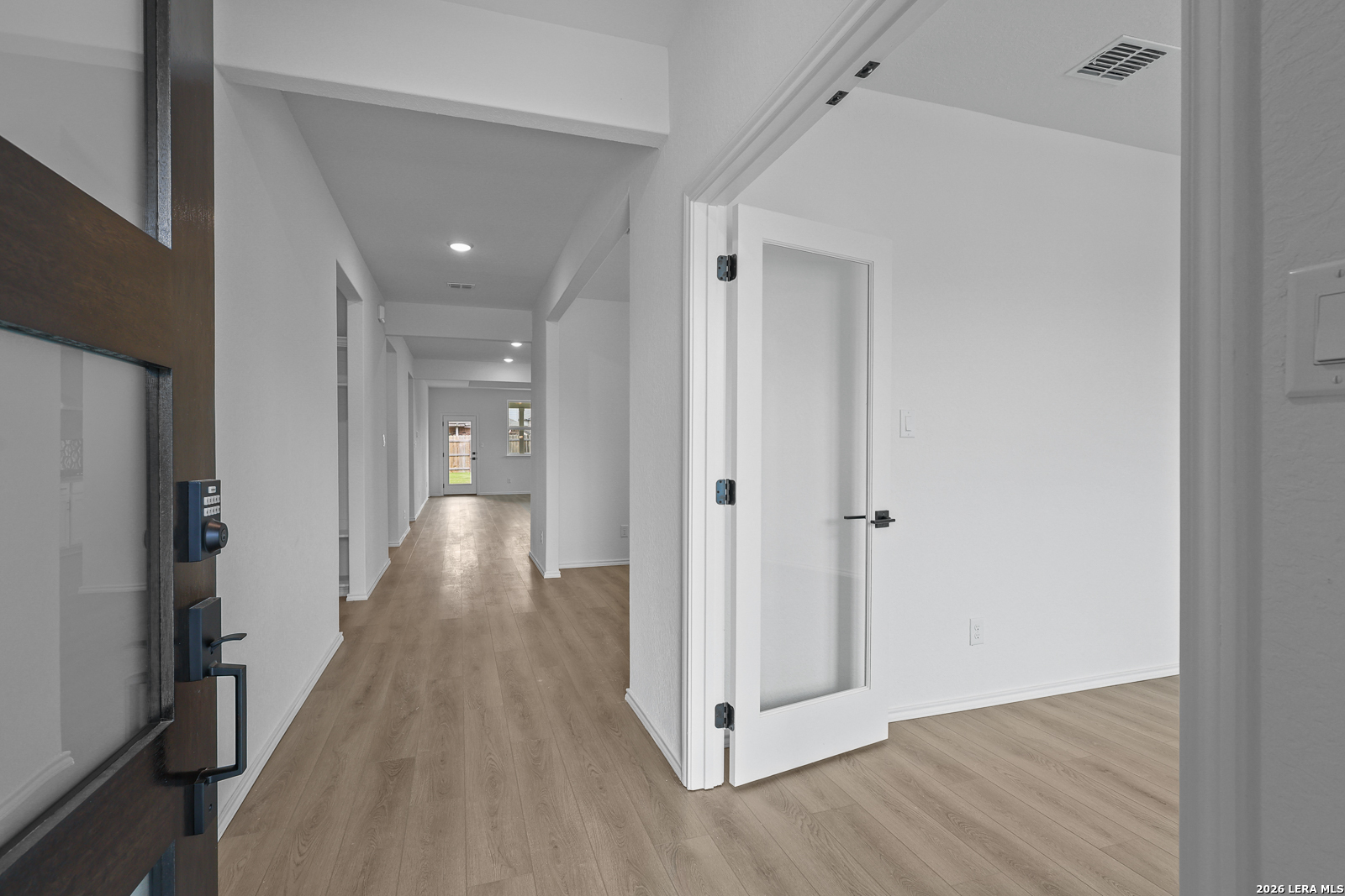 7432 Cremorne Converse, TX 78109 - Photo 4 of 35 a view of a hallway with wooden floor