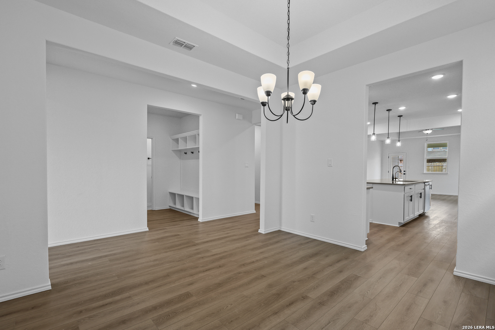 7432 Cremorne Converse, TX 78109 - Photo 9 of 35 a view of a room with wooden floor and kitchen view