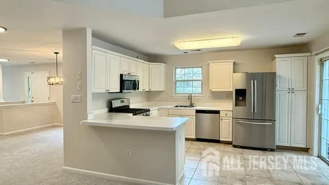 a kitchen with a refrigerator stove and microwave