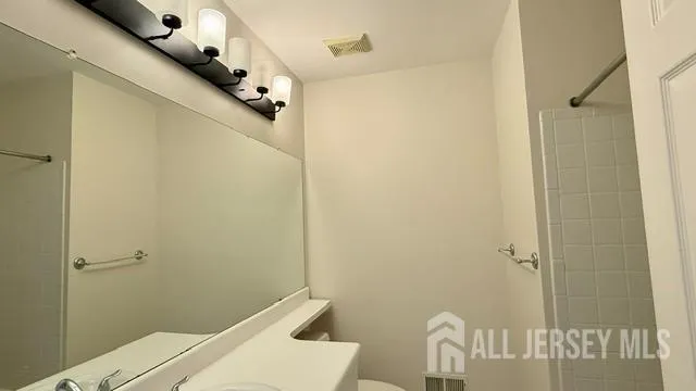 a bathroom with a sink and shower