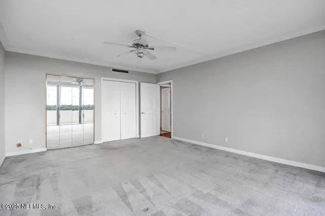 a view of a swimming pool and lounge chairs