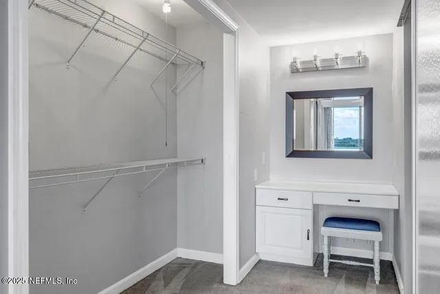 a view of a livingroom with furniture and a potted plant