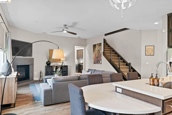 a living room with fireplace furniture and a wooden floor