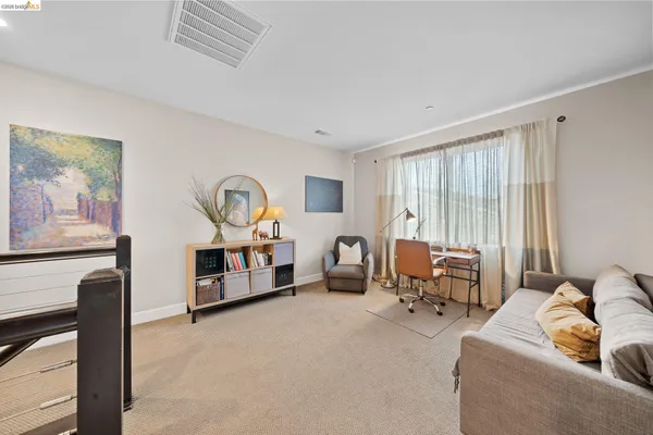 a bedroom with furniture and a window