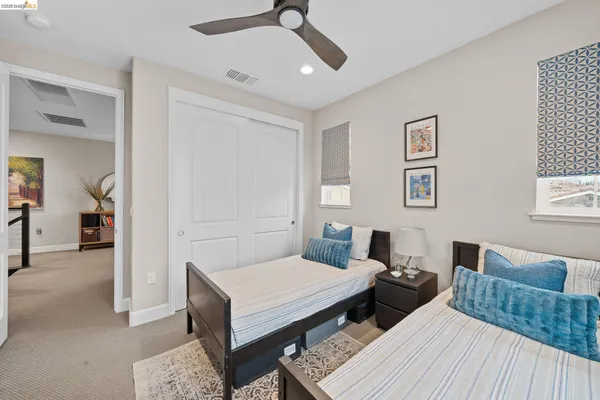 a bedroom with a bed gym equipment and a window