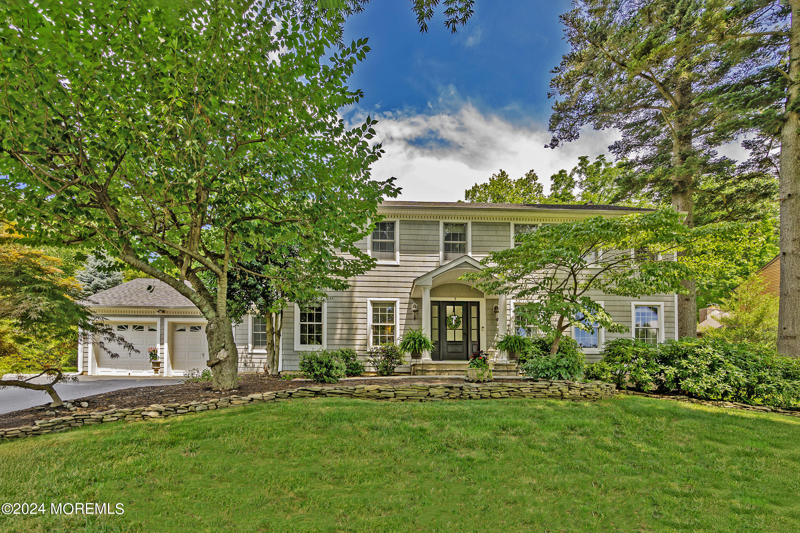 9 Doherty Drive Middletown, NJ 07748 - Photo 1 of 59 a front view of a house with a garden