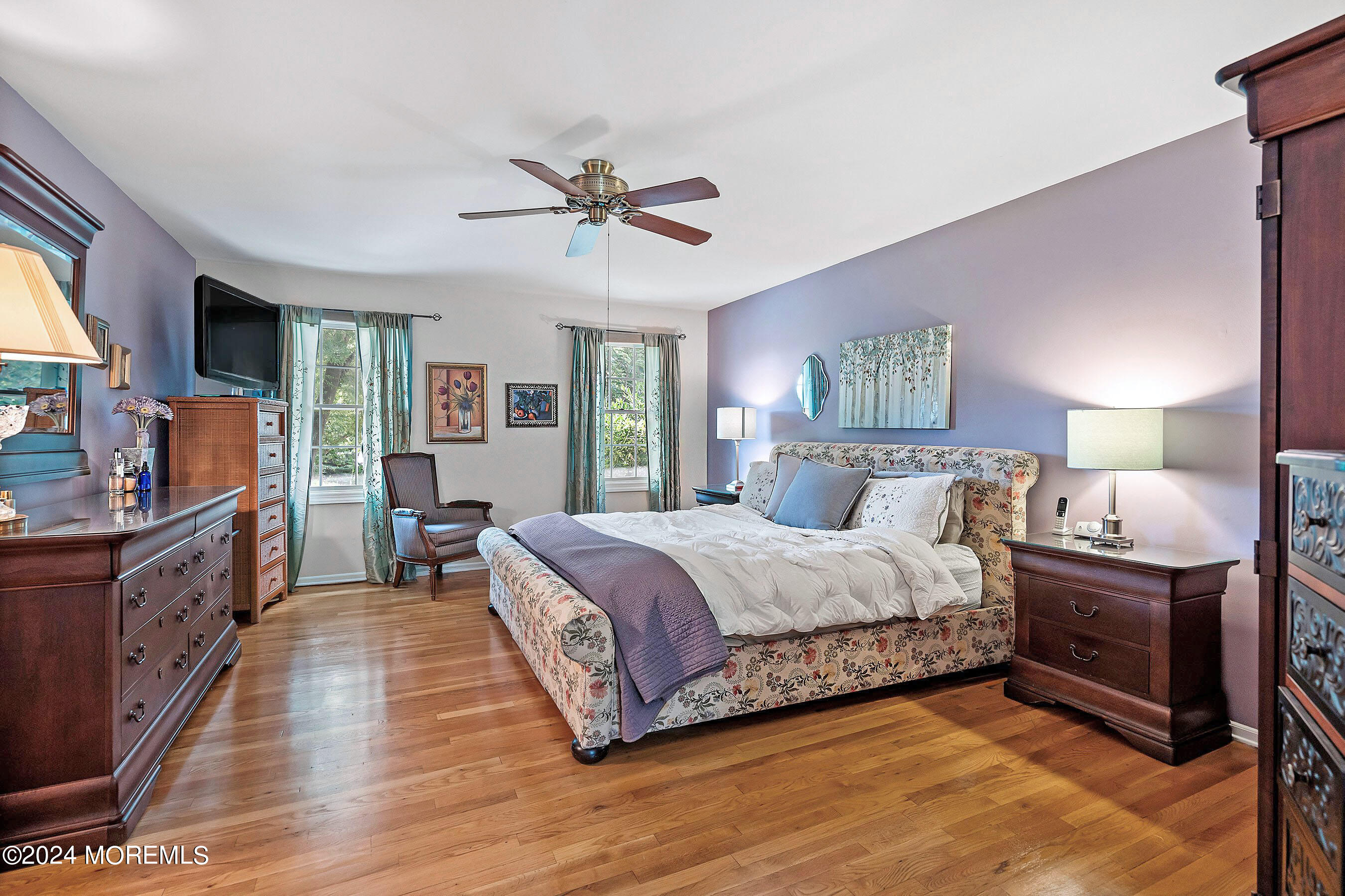 9 Doherty Drive Middletown, NJ 07748 - Photo 24 of 59 a spacious bedroom with a large bed and a chandelier