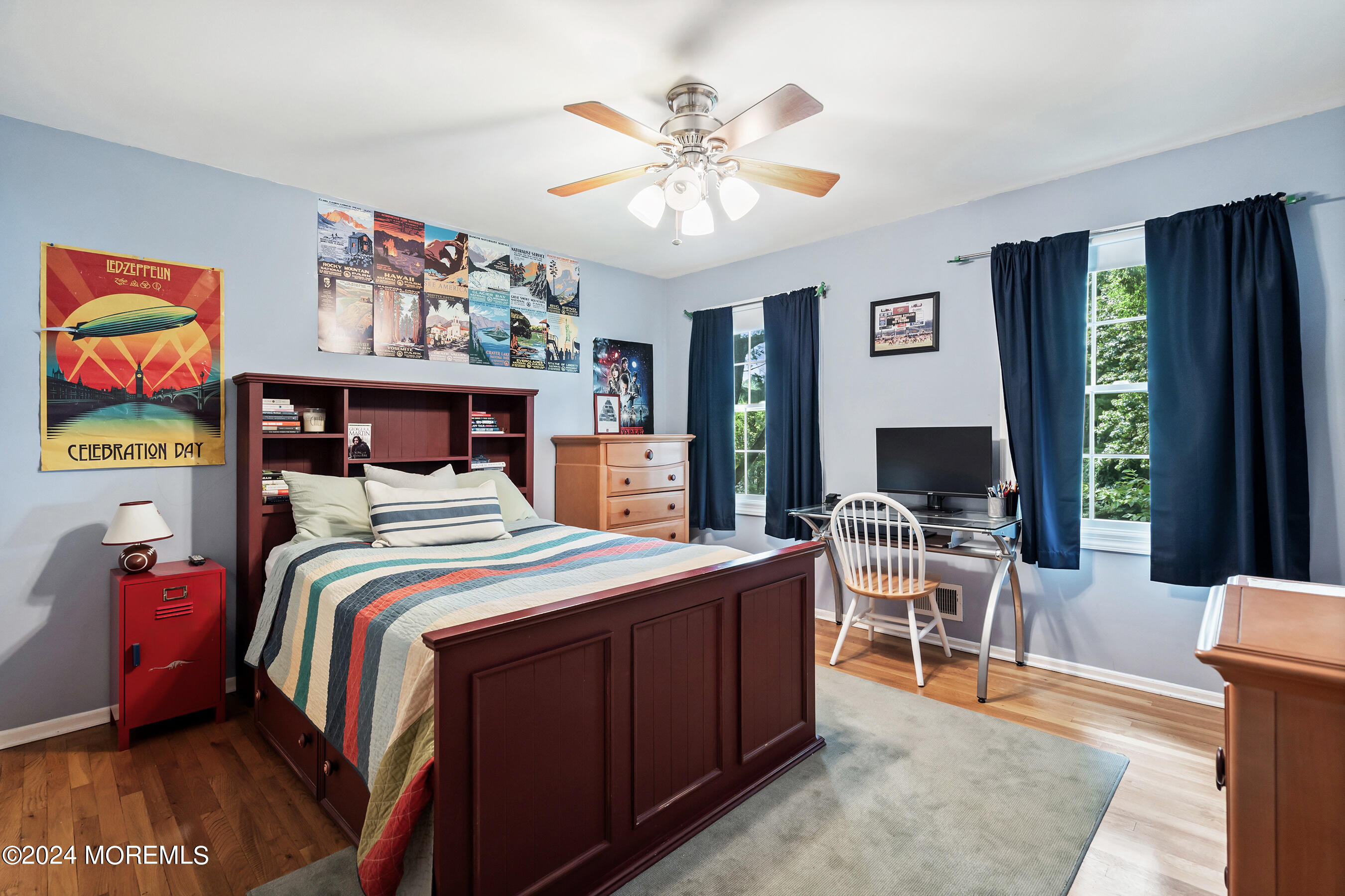 9 Doherty Drive Middletown, NJ 07748 - Photo 29 of 59 a bedroom with a bed and a chandelier
