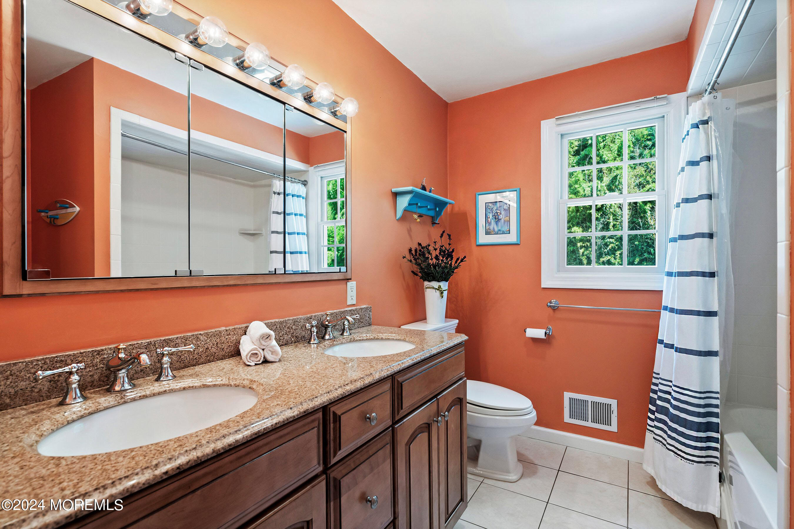 9 Doherty Drive Middletown, NJ 07748 - Photo 30 of 59 a bathroom with a granite countertop toilet a sink a mirror a window and shower