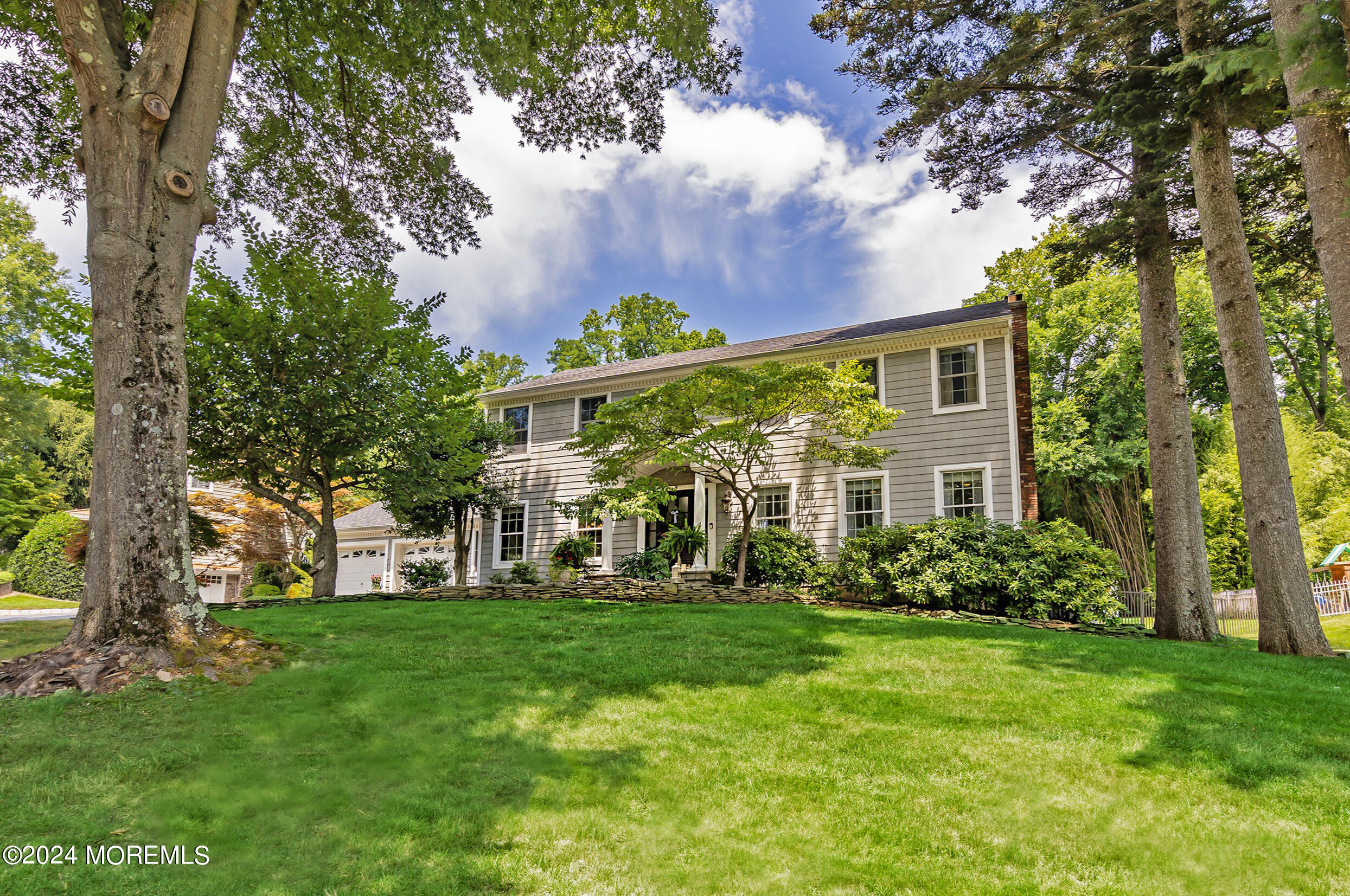 9 Doherty Drive Middletown, NJ 07748 - Photo 3 of 59 a front view of a house with garden