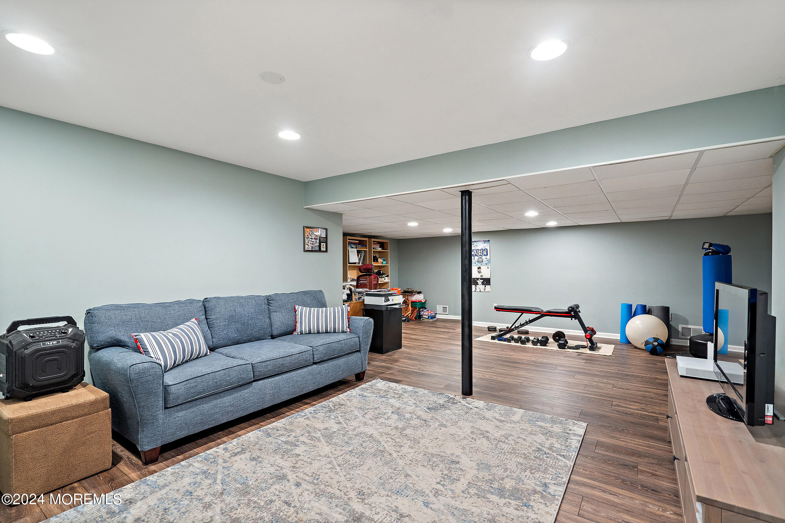 9 Doherty Drive Middletown, NJ 07748 - Photo 31 of 59 a living room with furniture and a wooden floor