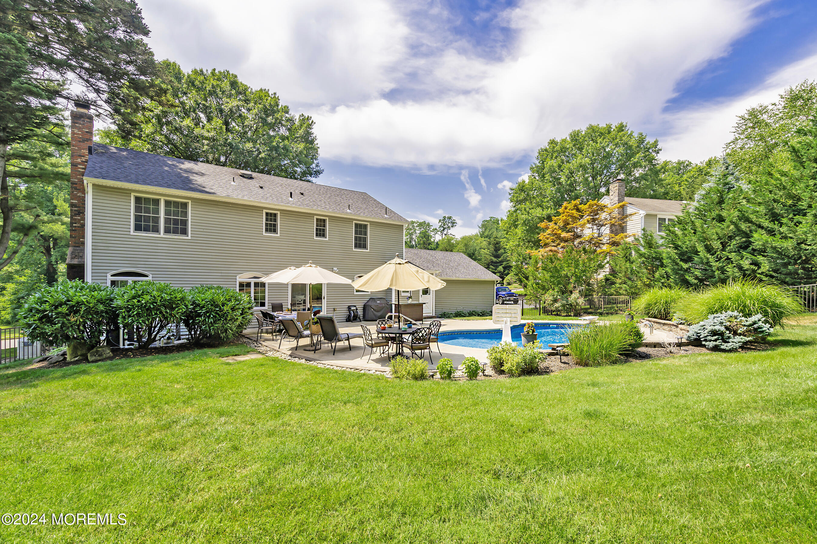 9 Doherty Drive Middletown, NJ 07748 - Photo 33 of 59 a view of a house with backyard porch and sitting area