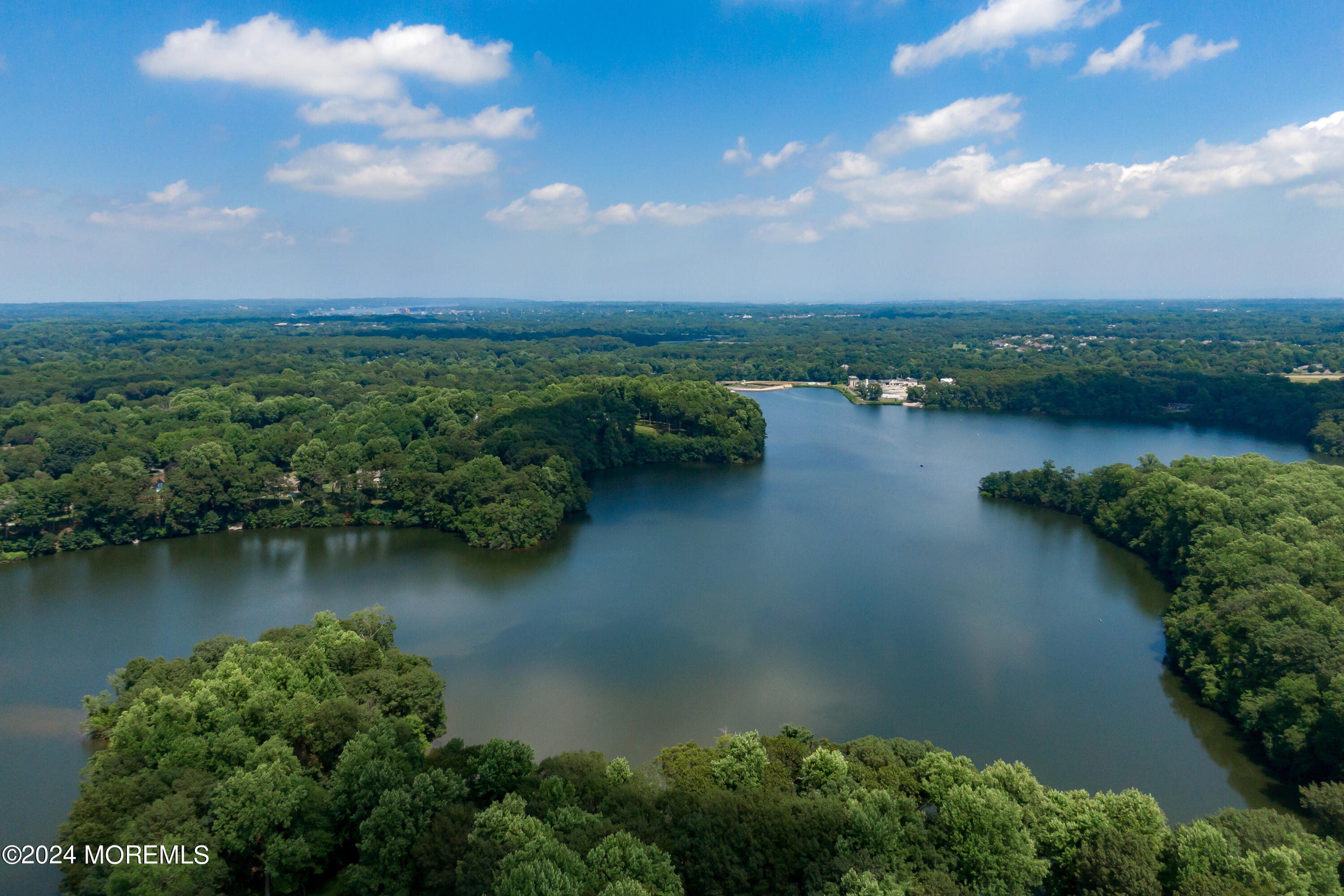 9 Doherty Drive Middletown, NJ 07748 - Photo 49 of 59 an aerial view of green landscape with lake view