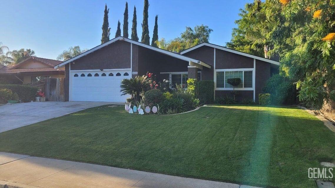 a front view of house with garden