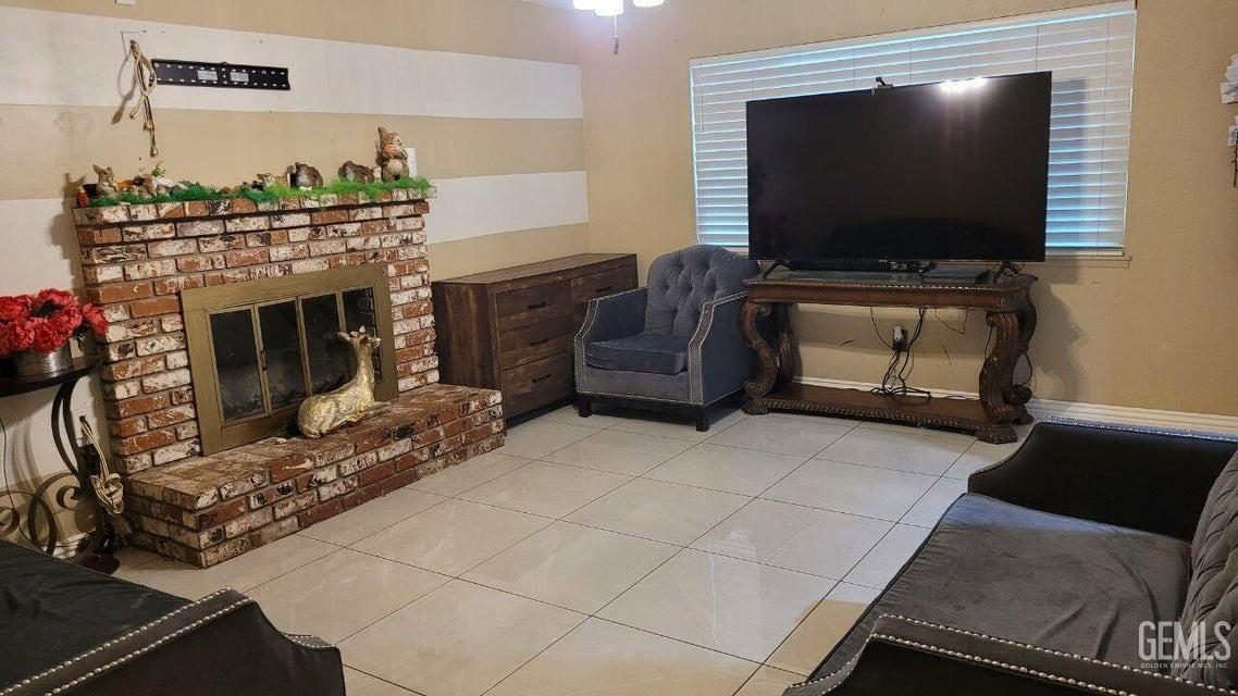 Undisclosed Address Bakersfield, CA 93309 - Photo 3 of 8 a living room with furniture and a flat screen tv