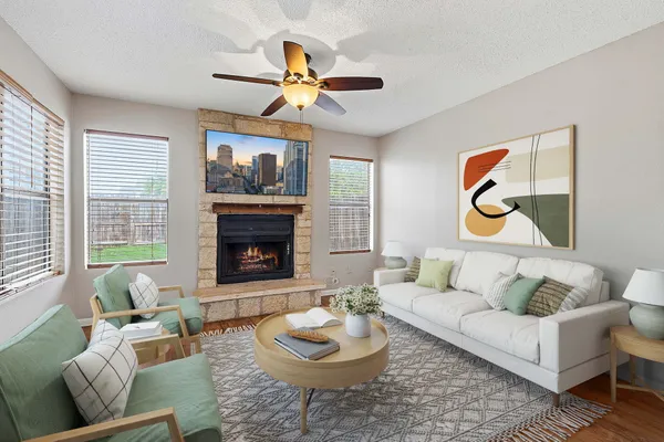 a living room with furniture and a fireplace