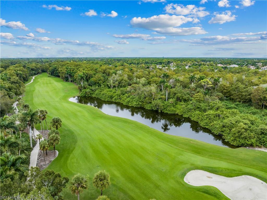 107 Clubhouse Drive, Unit 258 Naples, FL 34105 - Photo 25 of 34 Clubhouse drive and #2 hole at Wildernes