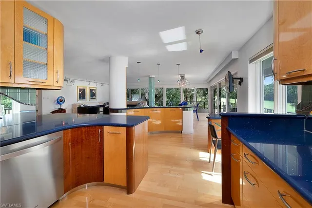 a kitchen with stainless steel appliances granite countertop sink stove and cabinets