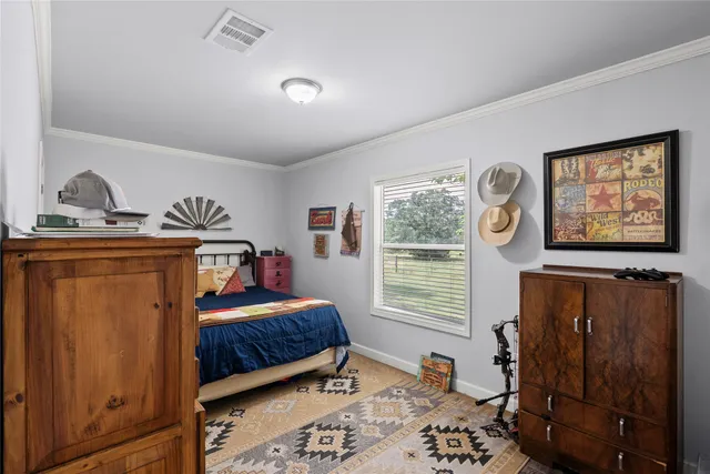 a front view of a house with swimming pool and furniture
