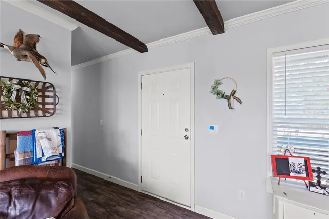 a view of hallway with furniture and toys