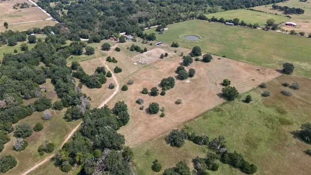 a view of a house with swimming pool and sitting area