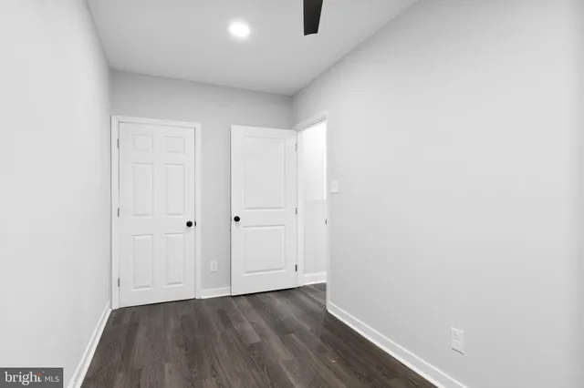 a view of an empty room and wooden floor