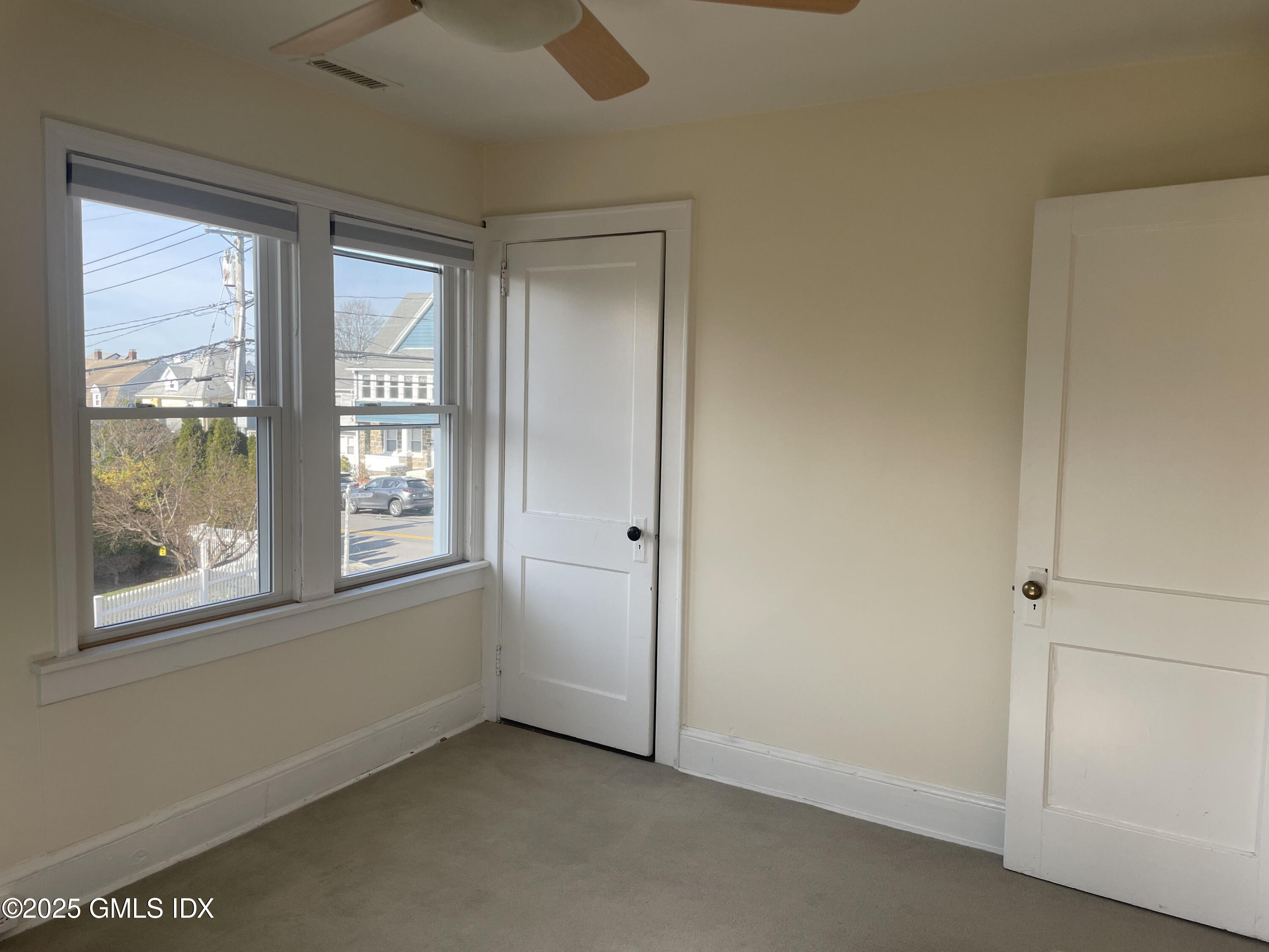 237 Hamilton Avenue, Unit 2 Greenwich, CT 06830 - Photo 13 of 20 an empty room with windows and closet
