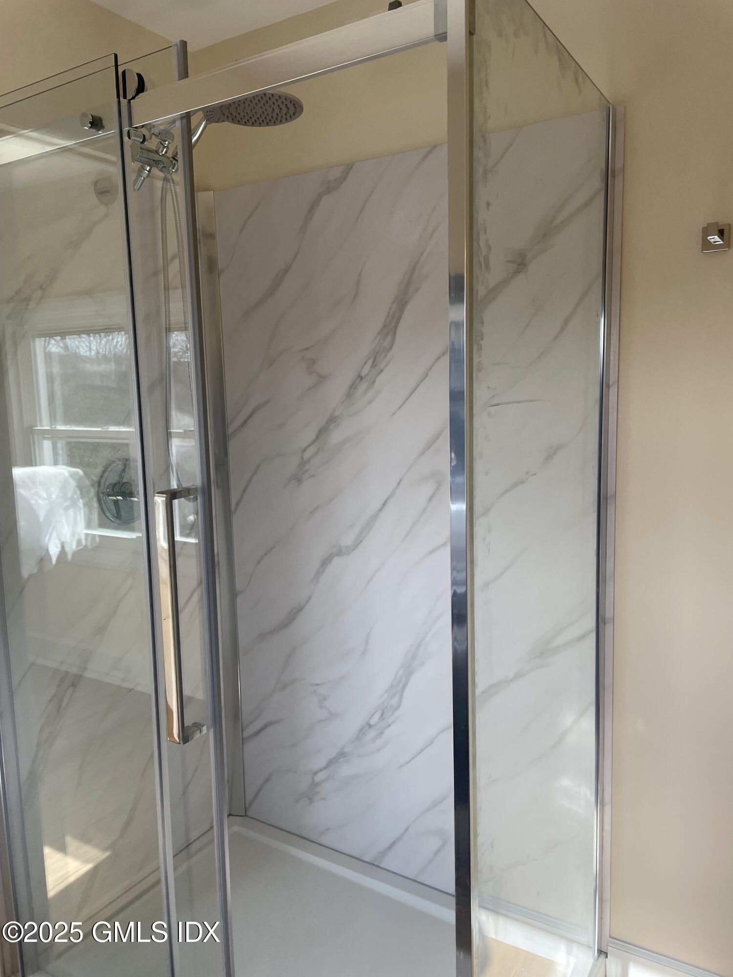 237 Hamilton Avenue, Unit 2 Greenwich, CT 06830 - Photo 16 of 20 a bathroom with a glass shower door