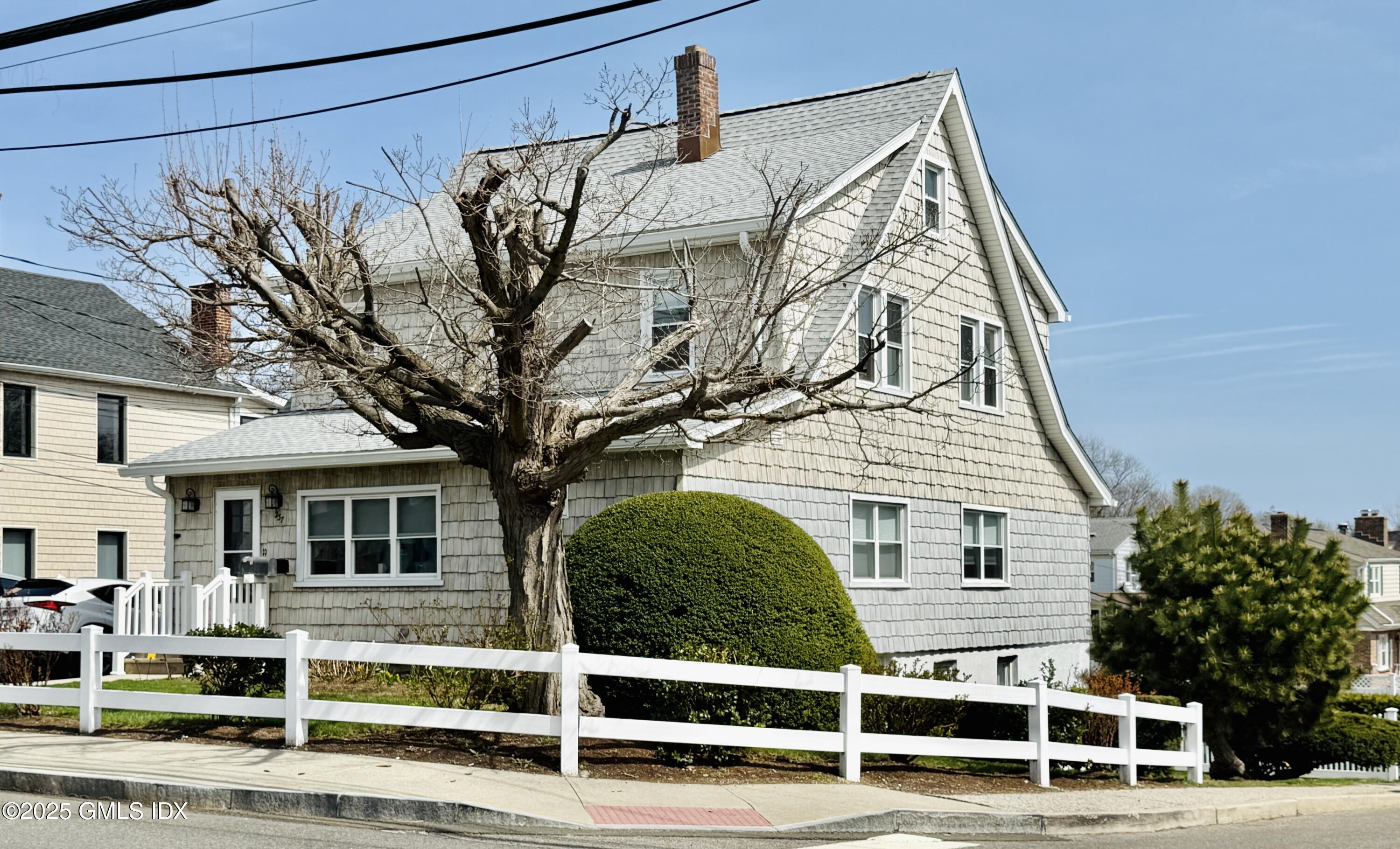 237 Hamilton Avenue, Unit 2 Greenwich, CT 06830 - Photo 18 of 20 a view of a house with a yard