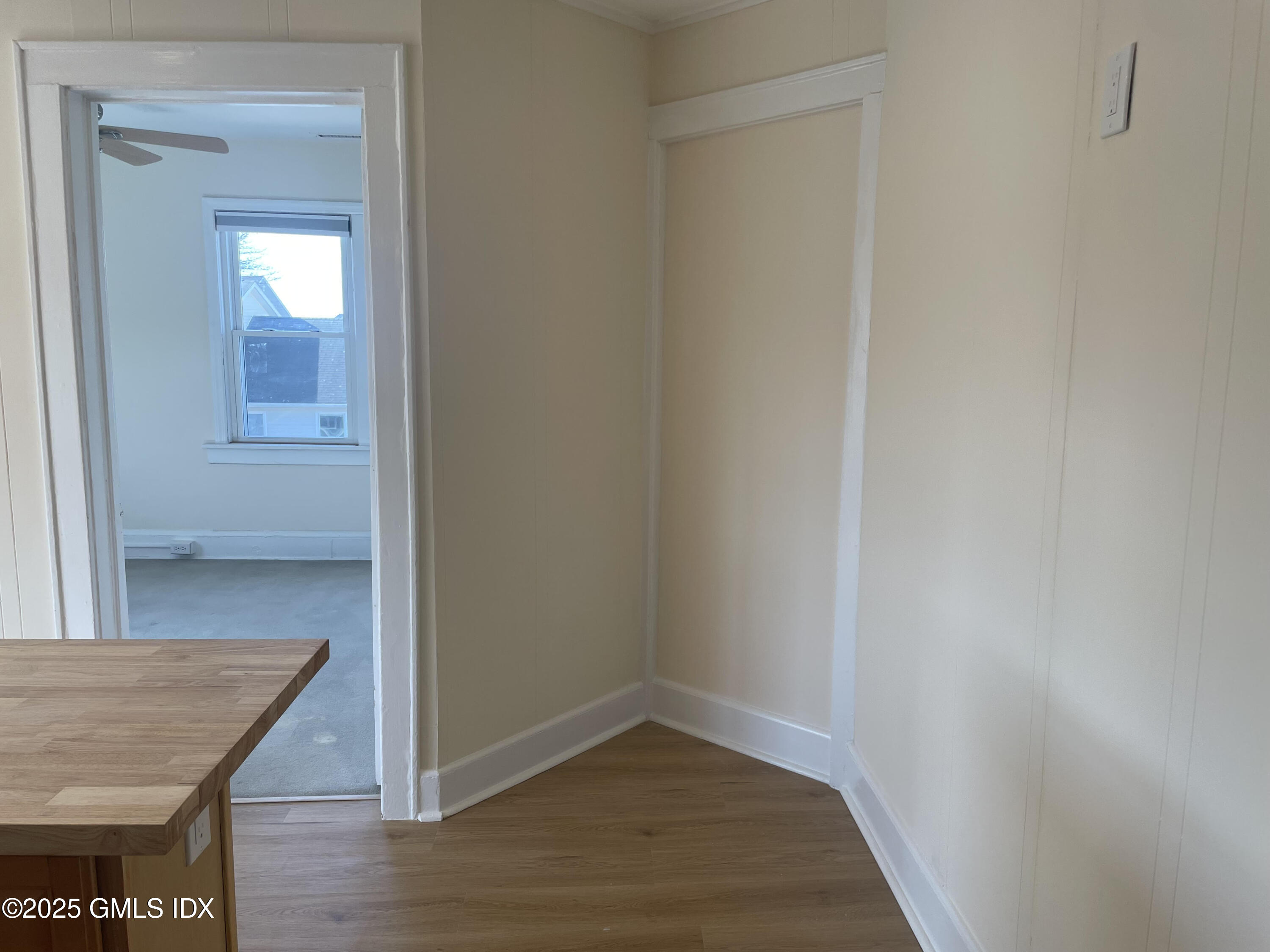 237 Hamilton Avenue, Unit 2 Greenwich, CT 06830 - Photo 5 of 20 a view of a hallway with wooden floor