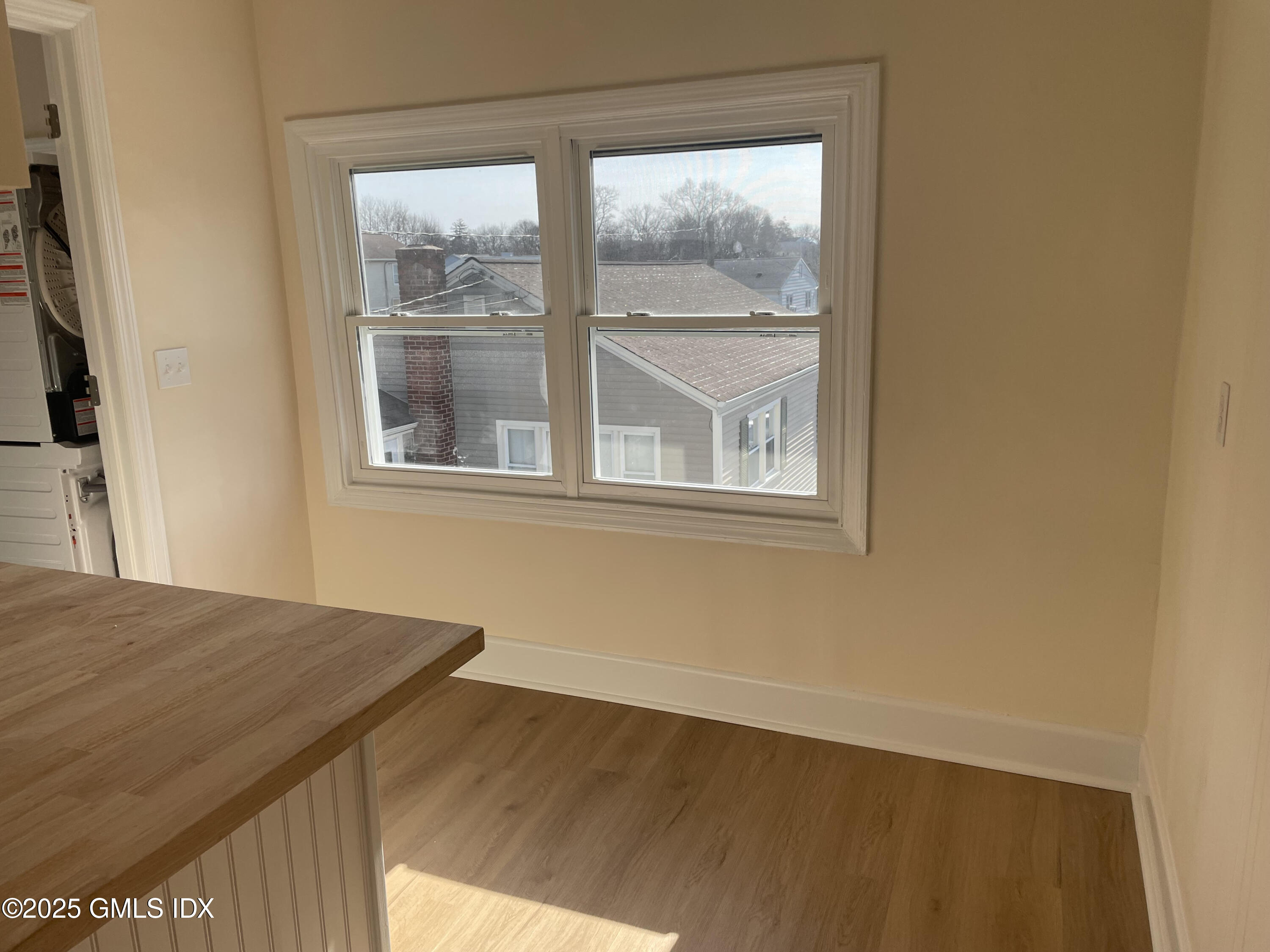 237 Hamilton Avenue, Unit 2 Greenwich, CT 06830 - Photo 9 of 20 a view of an empty room with a window