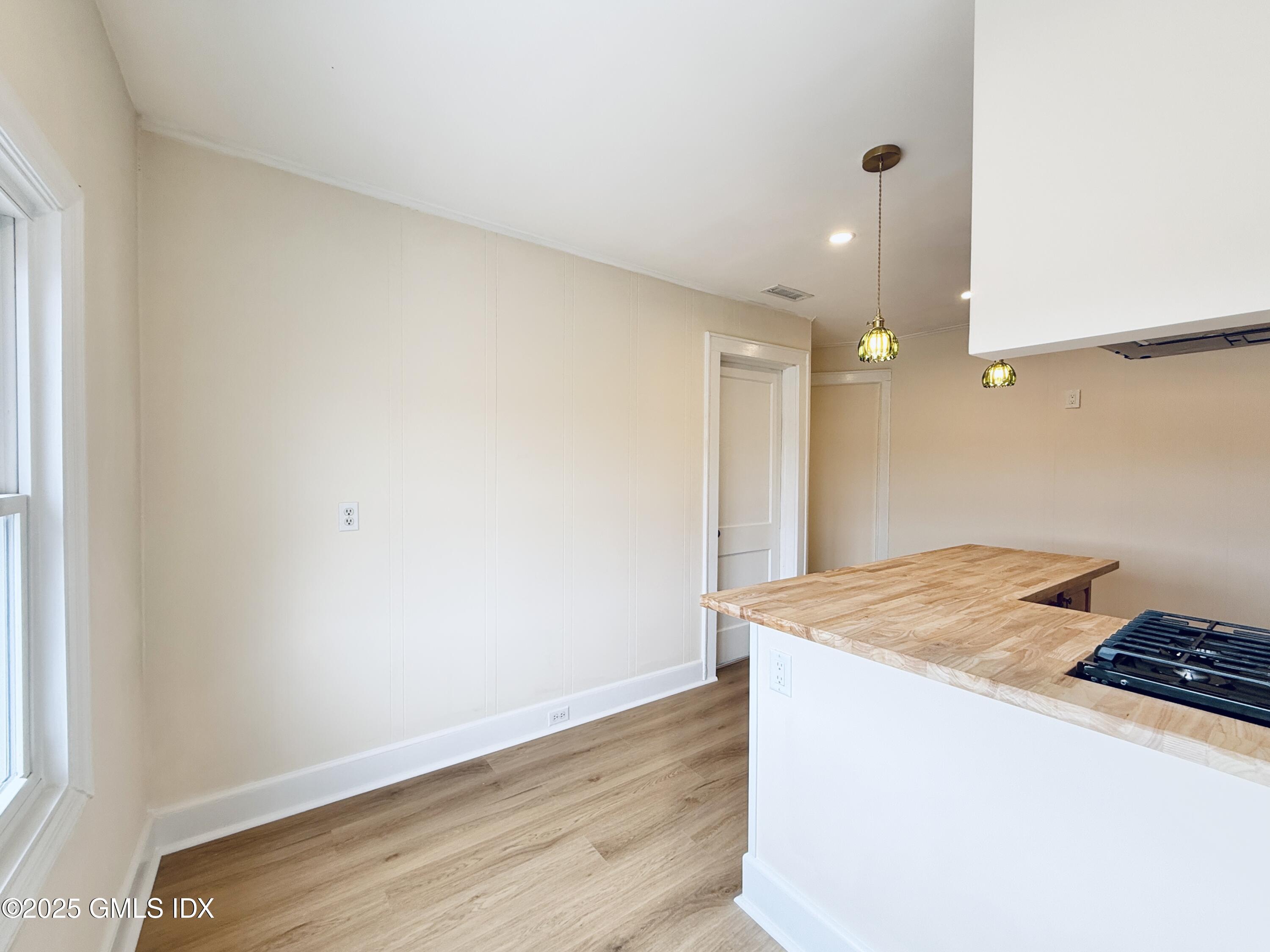 237 Hamilton Avenue, Unit 2 Greenwich, CT 06830 - Photo 10 of 20 a room with a sink and wooden floor