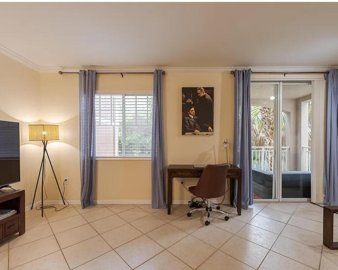 6556 Emerald Dunes Drive, Unit 207 West Palm Beach, FL 33411 - Photo 8 of 11 a view of a workspace with furniture and a window