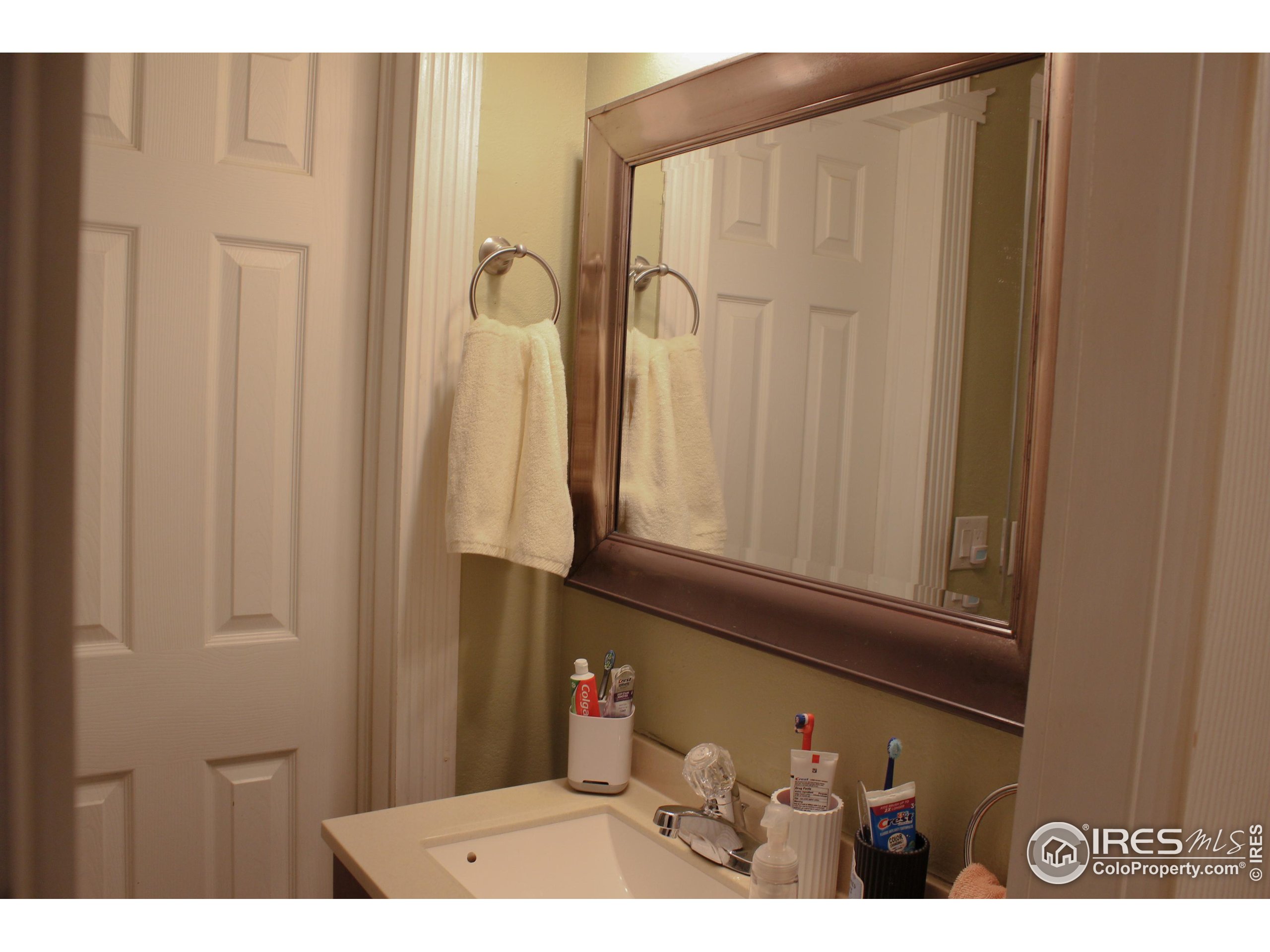 504 12th Street Greeley, CO 80631 - Photo 16 of 19 a picture of a bathroom with a shower curtain
