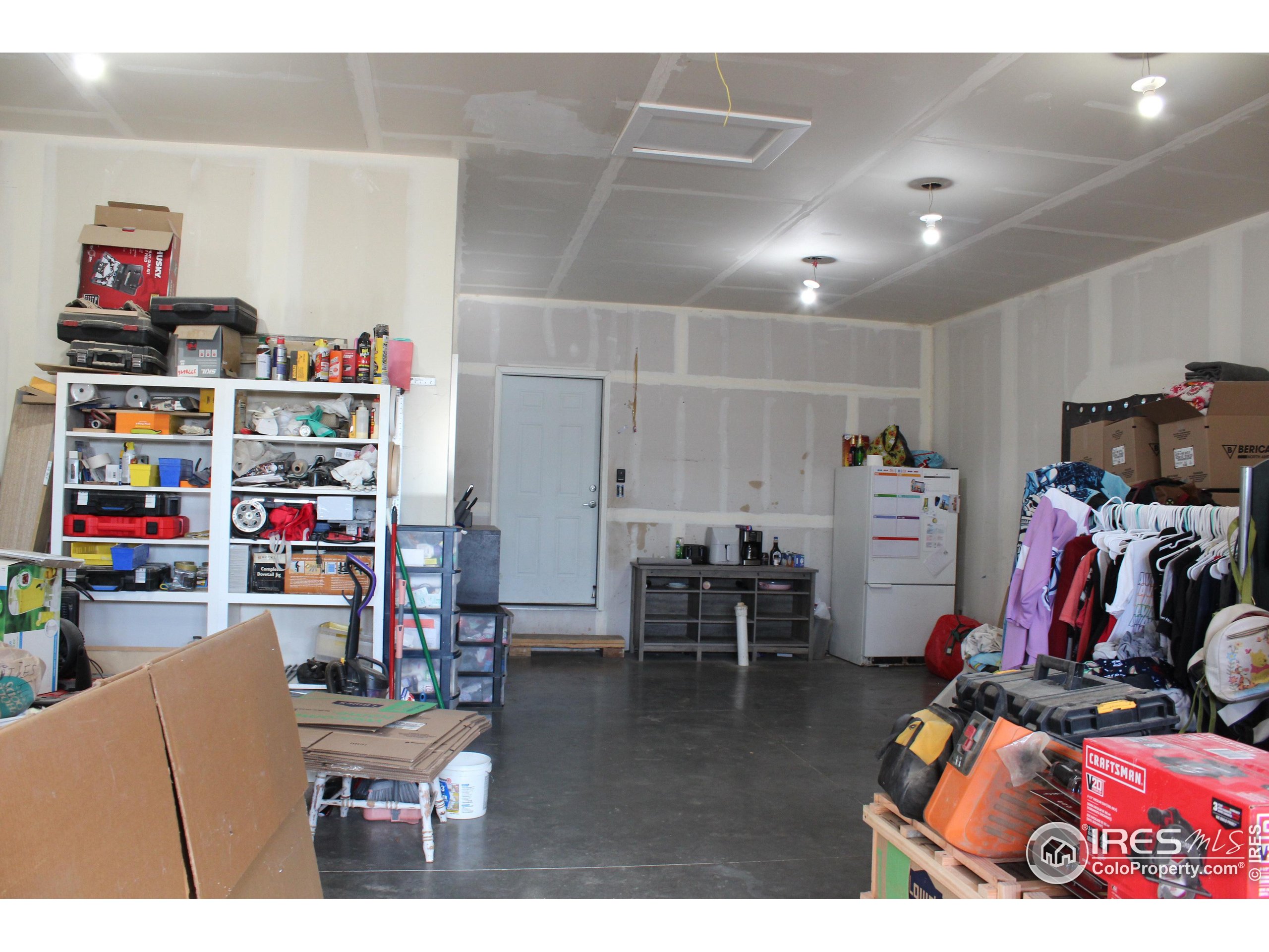 504 12th Street Greeley, CO 80631 - Photo 18 of 19 a living room with furniture and a gym equipment