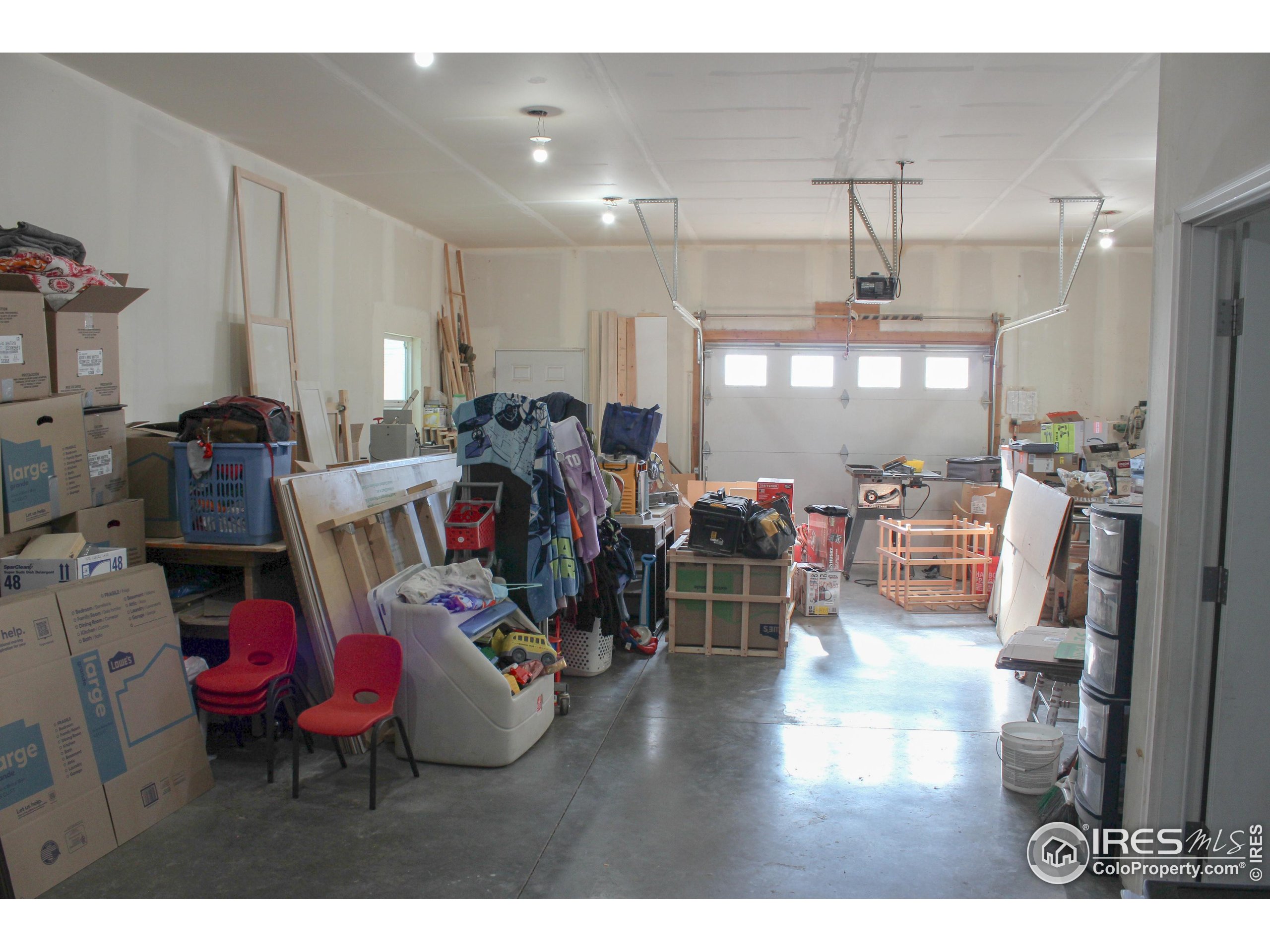 504 12th Street Greeley, CO 80631 - Photo 19 of 19 a living room with lots of furniture and kitchen view