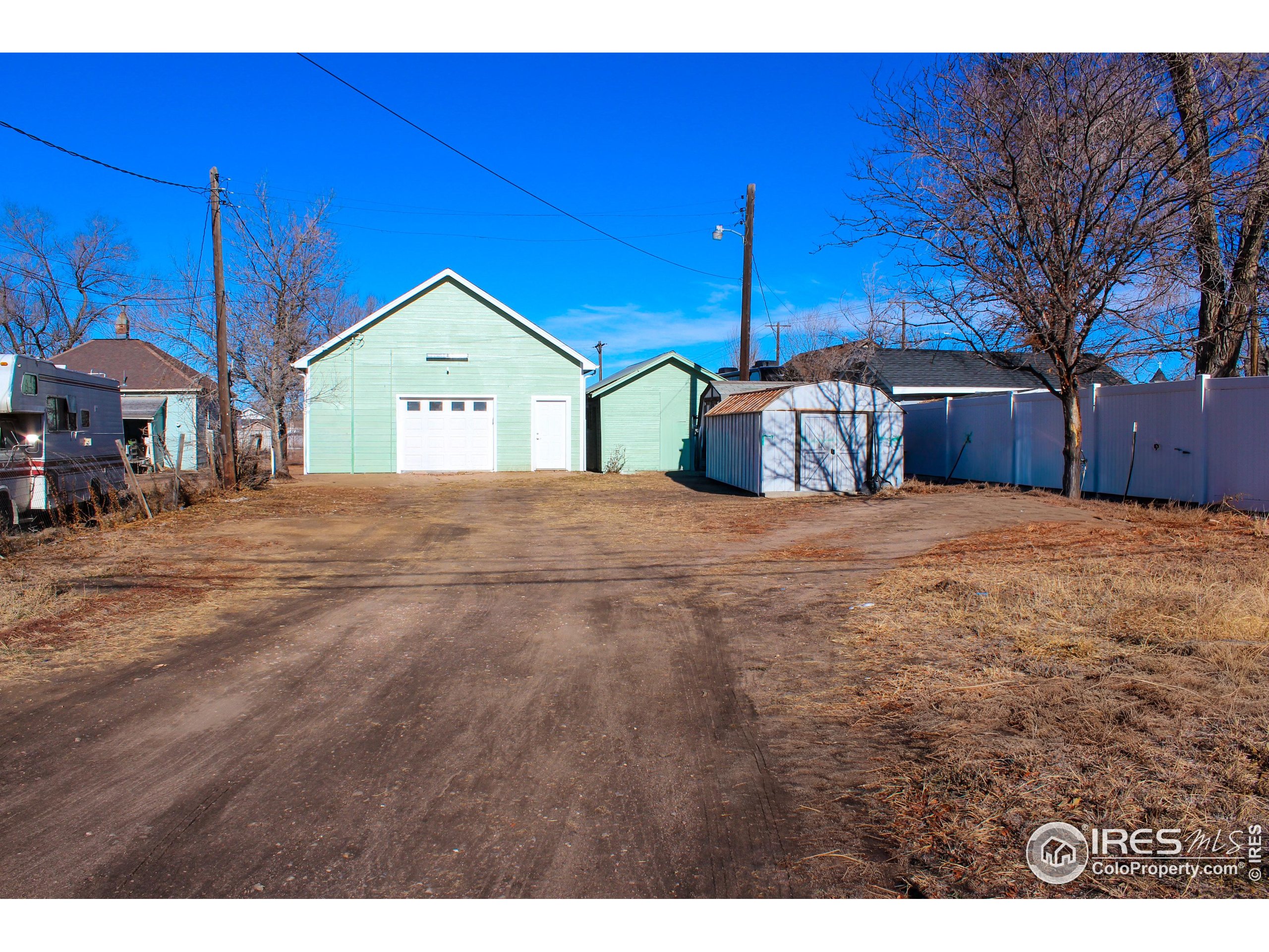 504 12th Street Greeley, CO 80631 - Photo 2 of 19 a view of a yard with a house