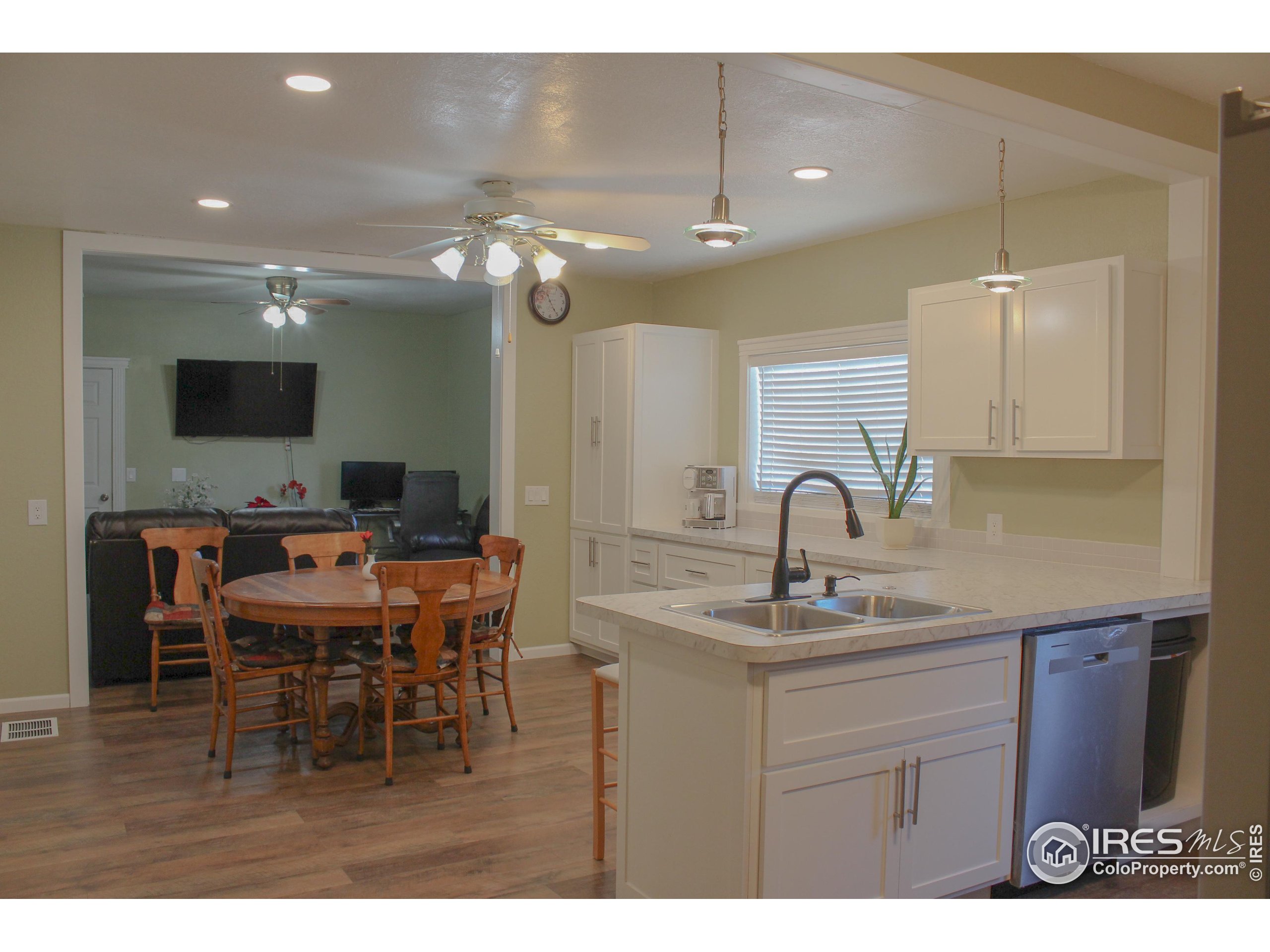 504 12th Street Greeley, CO 80631 - Photo 6 of 19 a kitchen with a sink cabinets and window