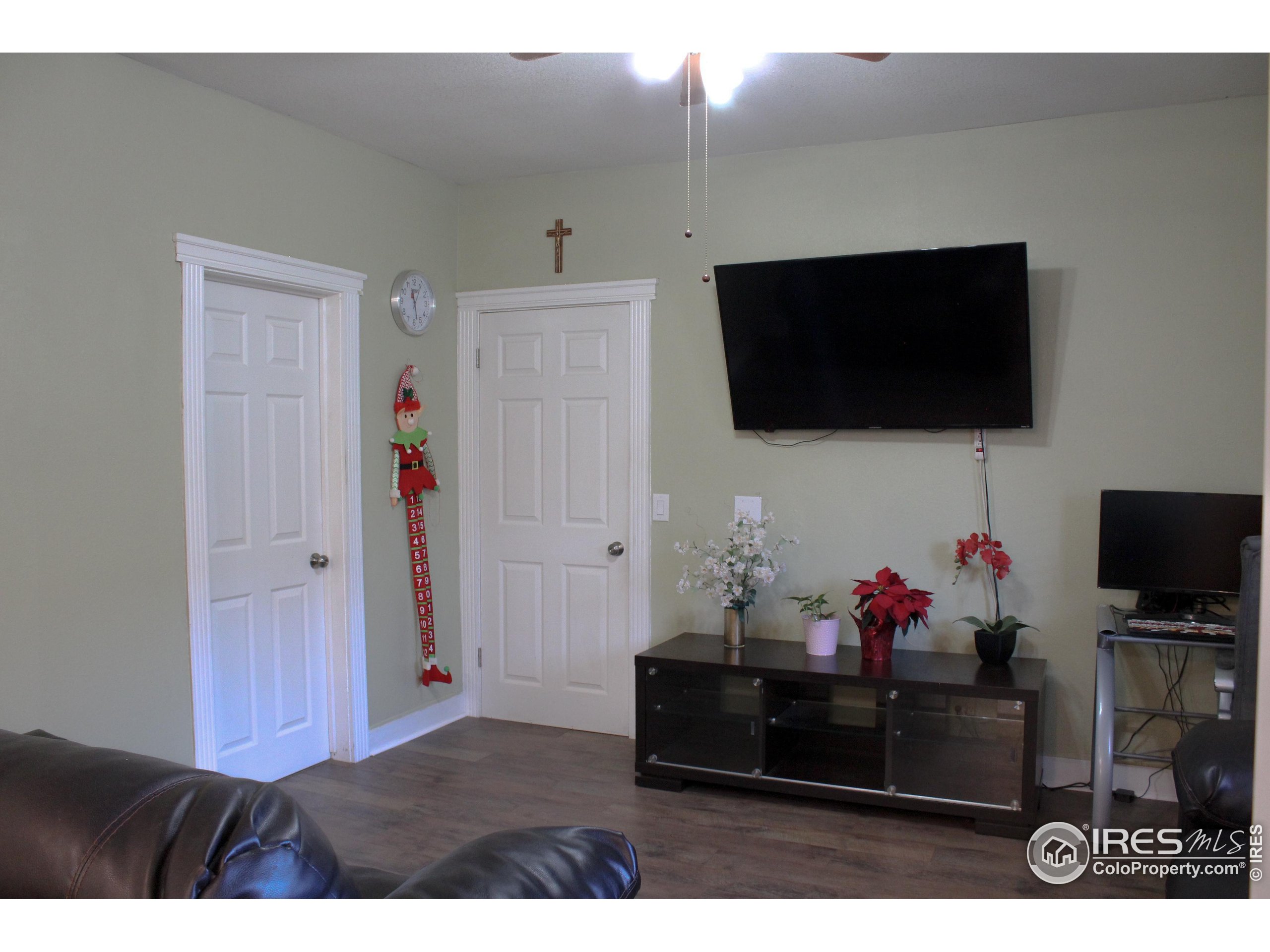 504 12th Street Greeley, CO 80631 - Photo 9 of 19 a living room with furniture and a flat screen tv