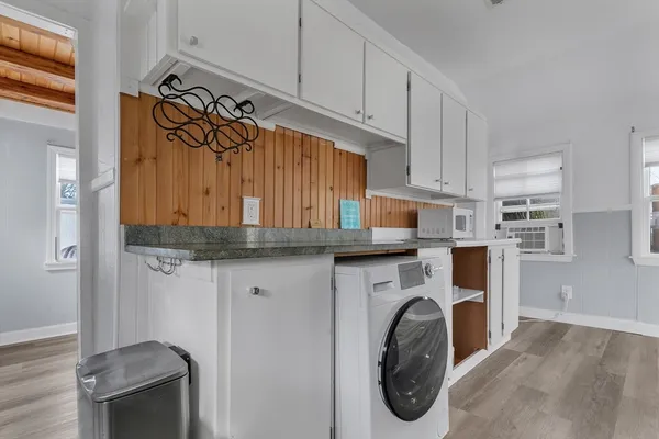 a utility room with sink dryer and washer