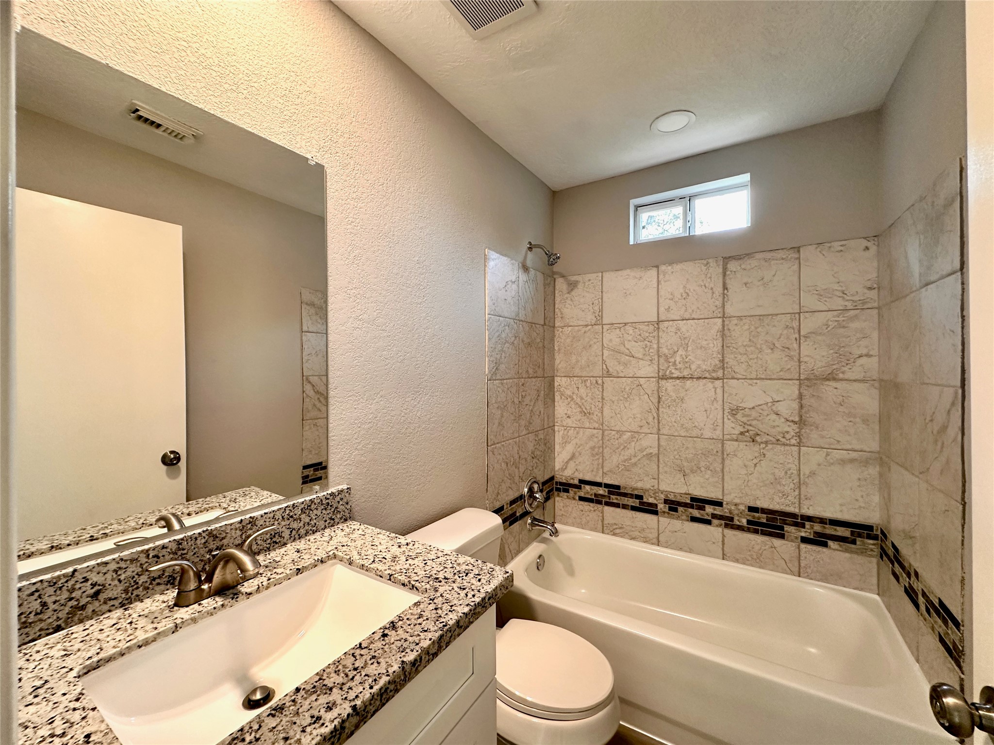 15134 Alkay Street Houston, TX 77053 - Photo 17 of 25 a bathroom with a granite countertop tub sink and mirror
