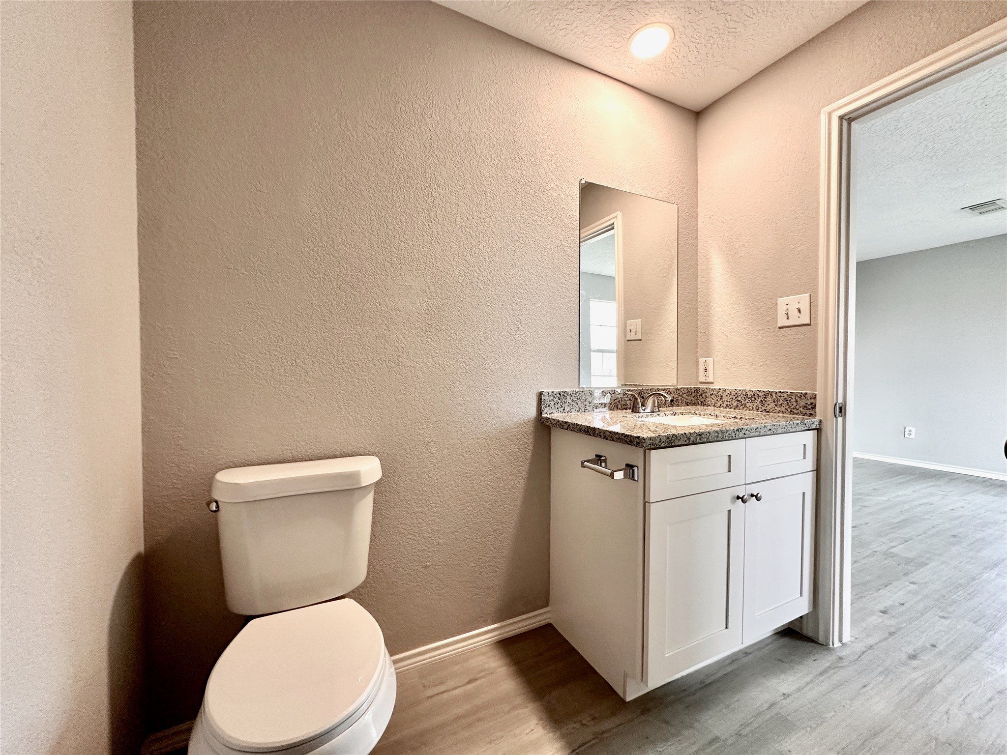 15134 Alkay Street Houston, TX 77053 - Photo 18 of 25 a white toilet sitting next to a bathroom sink